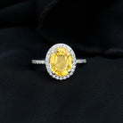 Rosec Jewels-Oval Cut Created Yellow Sapphire and Moissanite Classic Halo Engagement Ring