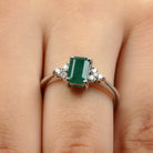 Rosec Jewels-Octagon Cut Emerald Engagement Ring with Diamond Trio