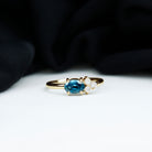 Rosec Jewels-1/2 CT Oval Cut London Blue Topaz Promise Ring with Diamond Trio