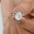 Rosec Jewels-1.50 CT Oval Shape Ethiopian Opal Engagement Ring with Diamond Halo