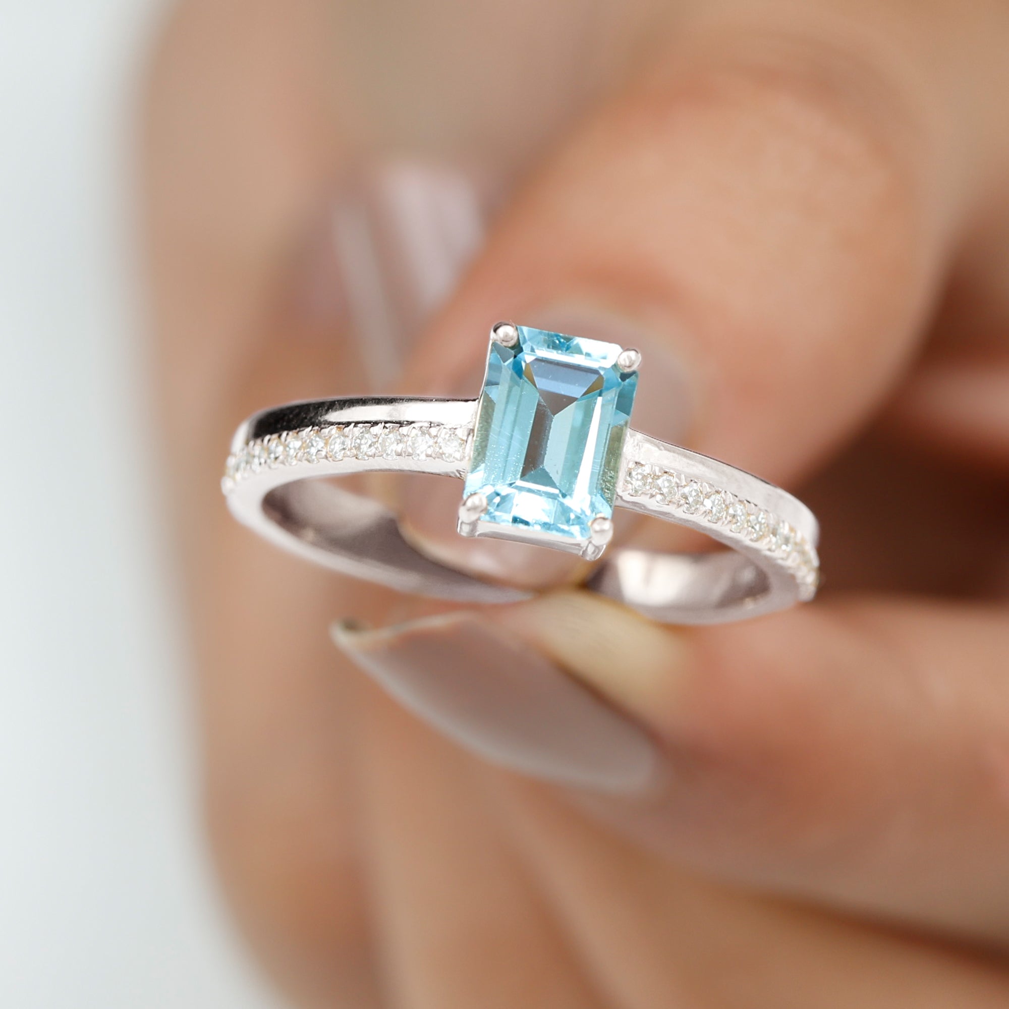 Rosec Jewels-Solitaire Engagement Ring with Emerald Cut Sky Blue Topaz and Diamond