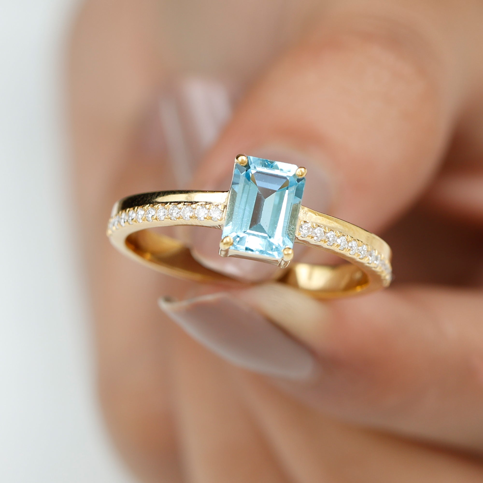 Rosec Jewels-Solitaire Engagement Ring with Emerald Cut Sky Blue Topaz and Diamond