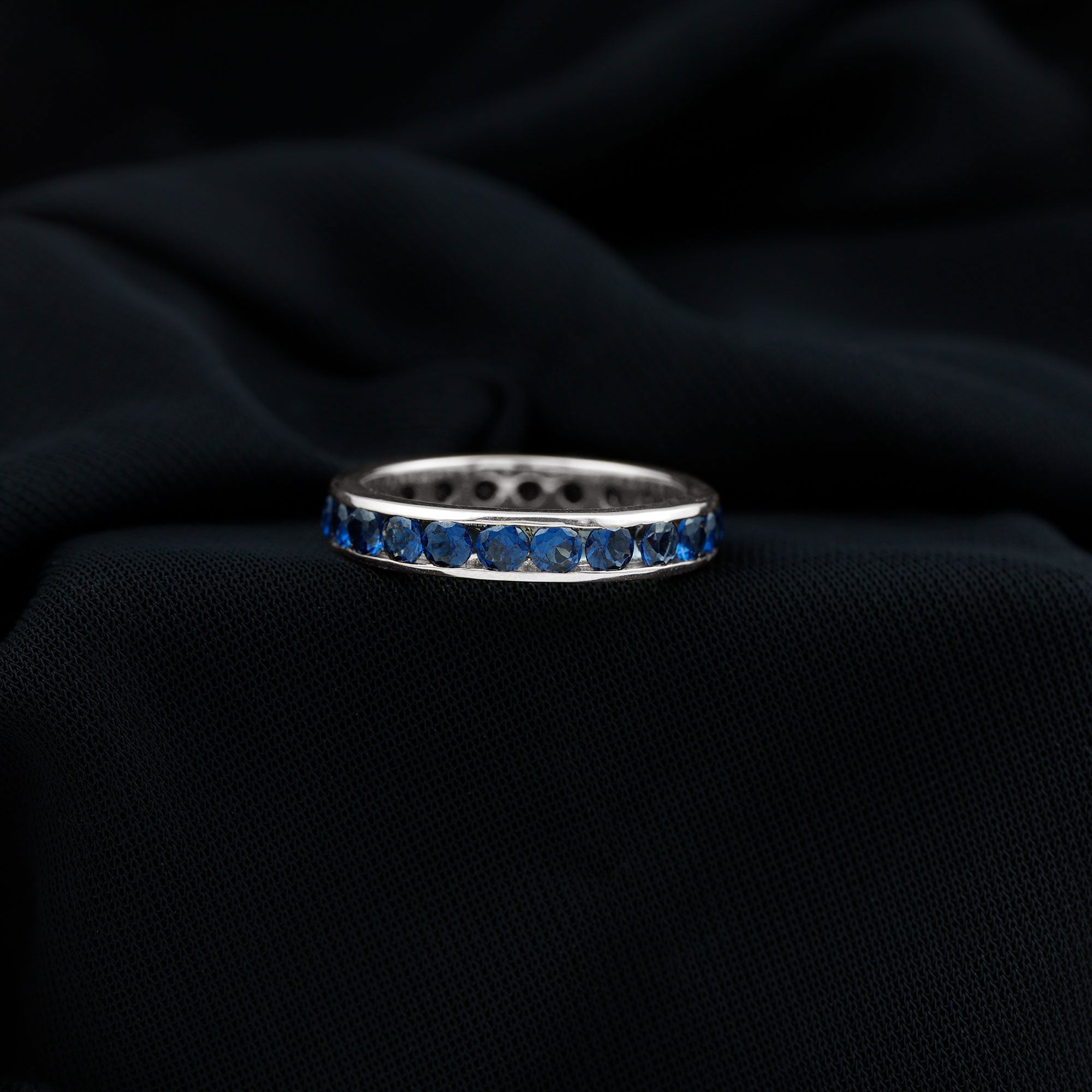 Rosec Jewels-Round Created Blue Sapphire Full Eternity Ring in Channel Setting