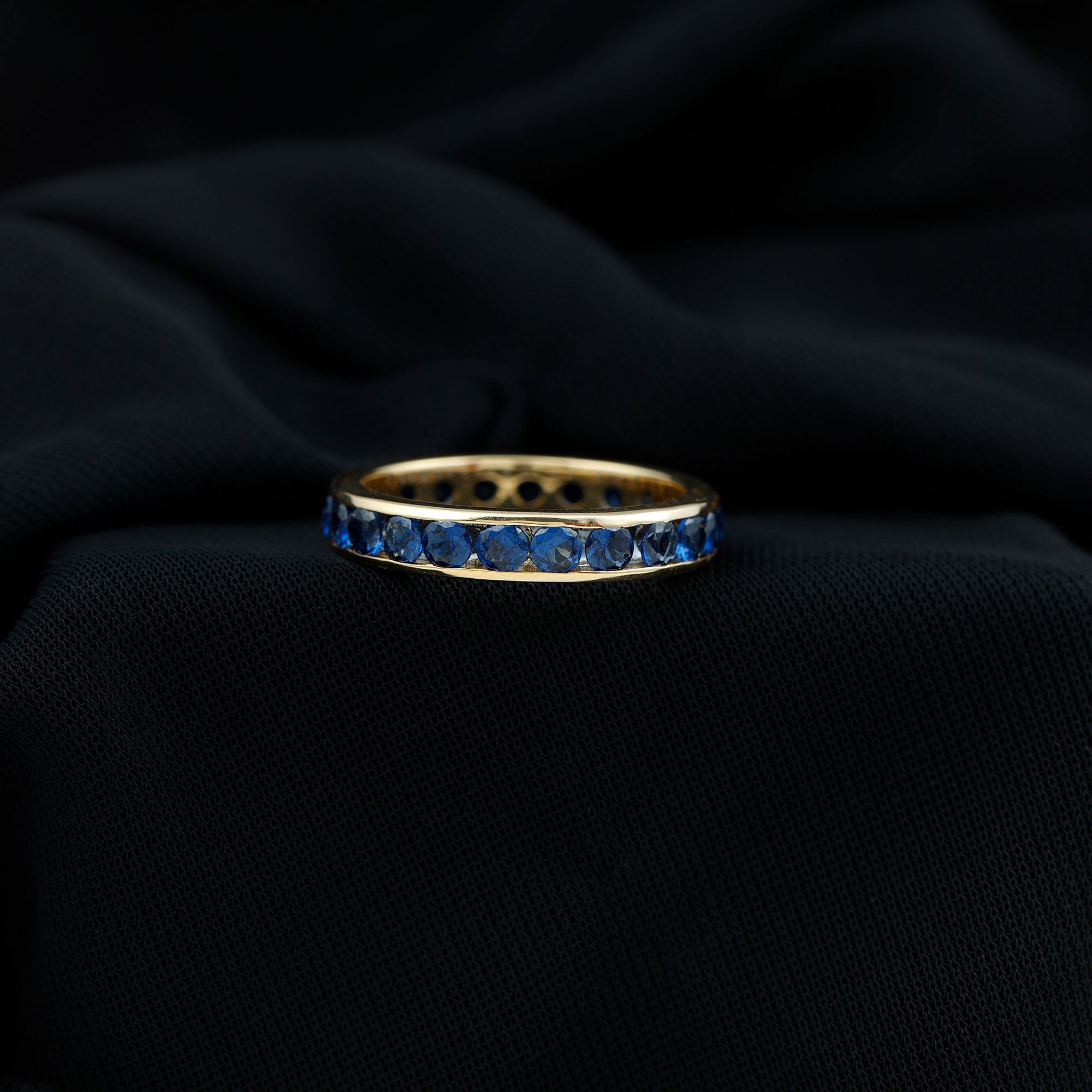 Rosec Jewels-Round Created Blue Sapphire Full Eternity Ring in Channel Setting