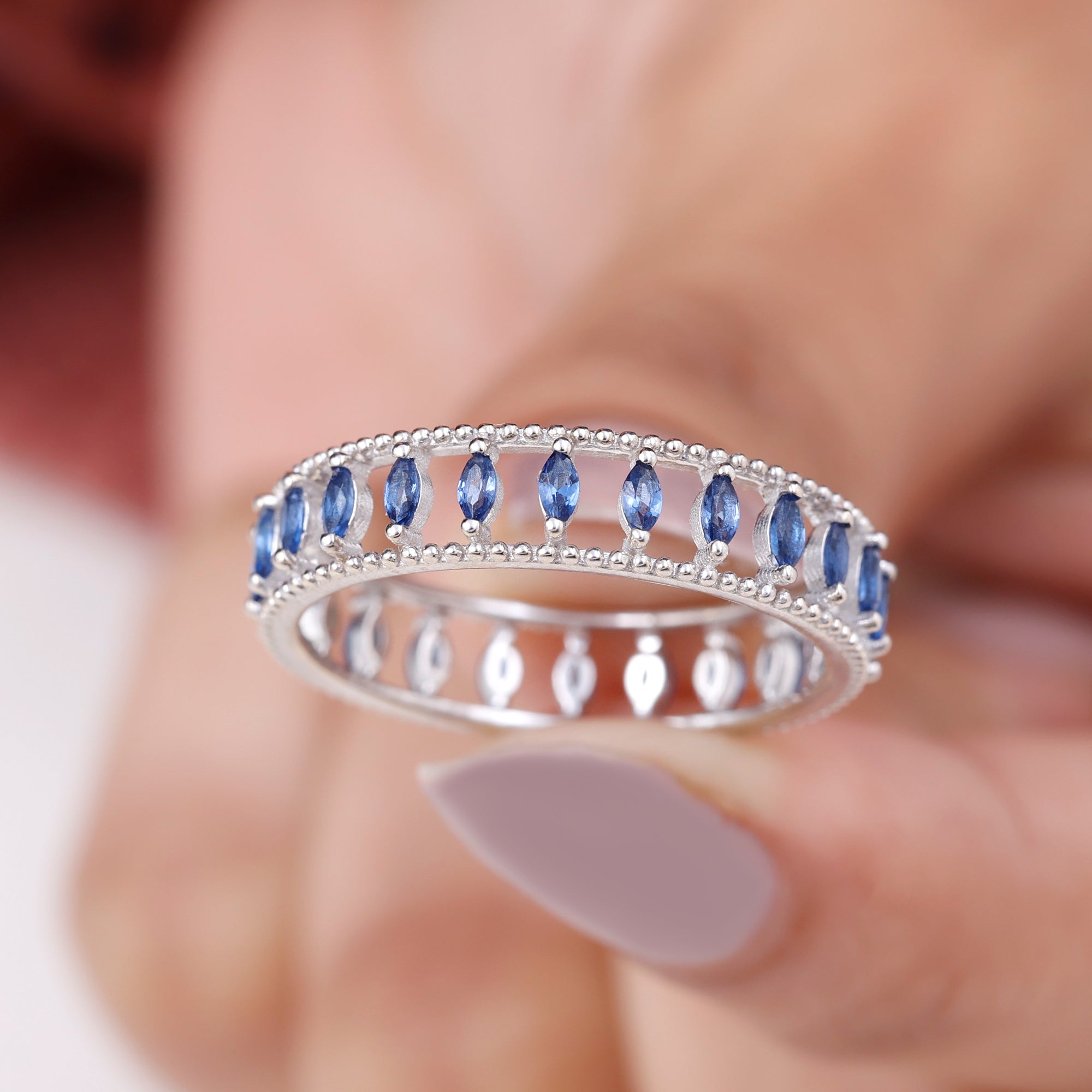 Rosec Jewels-Marquise Cut Created Blue Sapphire Eternity Band with Beaded Detailing