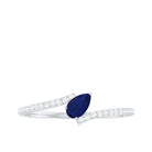 Rosec Jewels-Tilted Pear Cut Blue Sapphire Solitaire Bypass Ring with Diamond