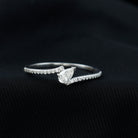 Rosec Jewels-Simple Bypass Promise Ring with Tilted Pear Shape Moissanite