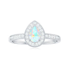 Rosec Jewels-Pear Shaped Ethiopian Opal and Diamond Halo Engagement Ring