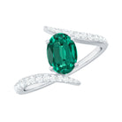 Rosec Jewels-Oval Shape Lab Grown Emerald Solitaire Bypass Ring with Moissanite