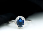 Rosec Jewels-2 CT Oval Cut Lab Created Blue Sapphire Ring with Diamond Halo and Side Stones