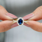 Rosec Jewels-2 CT Oval Cut Lab Created Blue Sapphire Ring with Diamond Halo and Side Stones